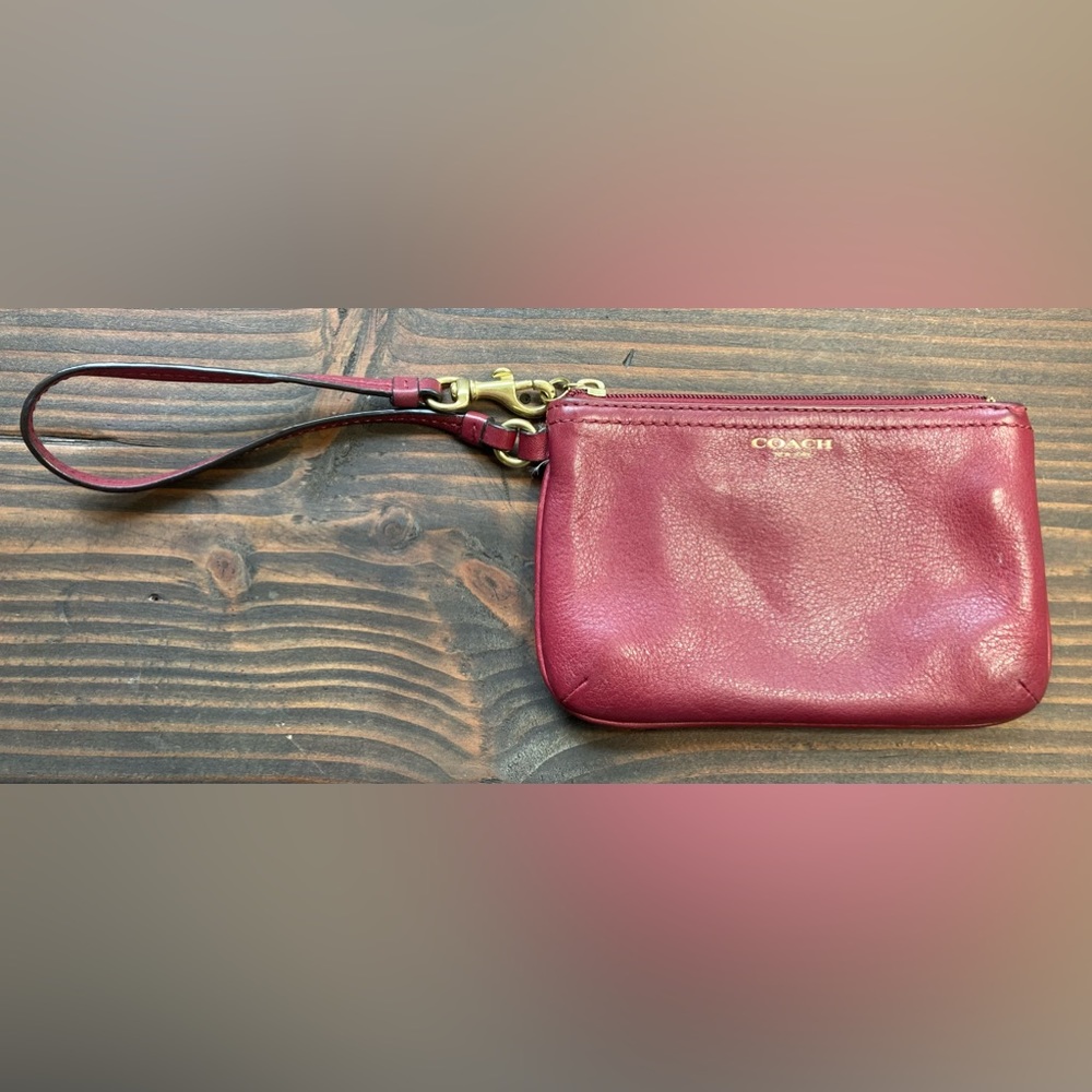Coach burgundy leather zip wristlet.
